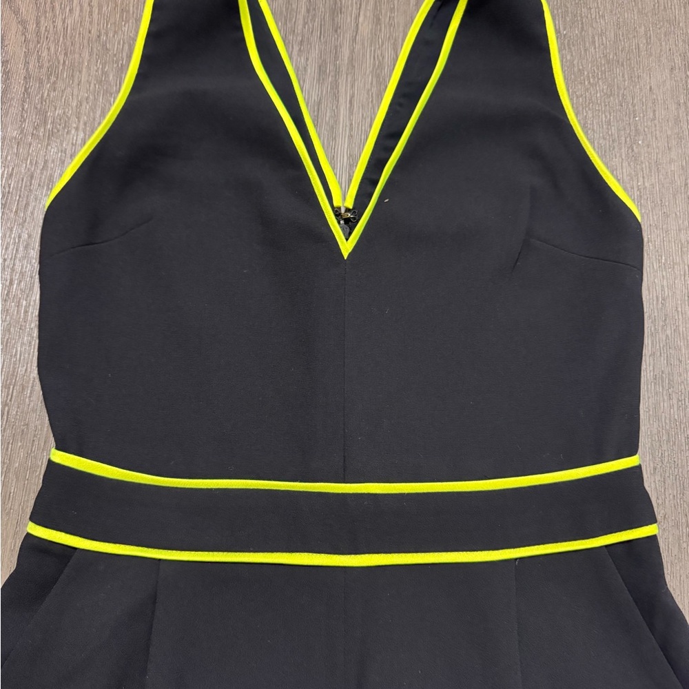 Black head turning jumpsuit with Yellow Trim